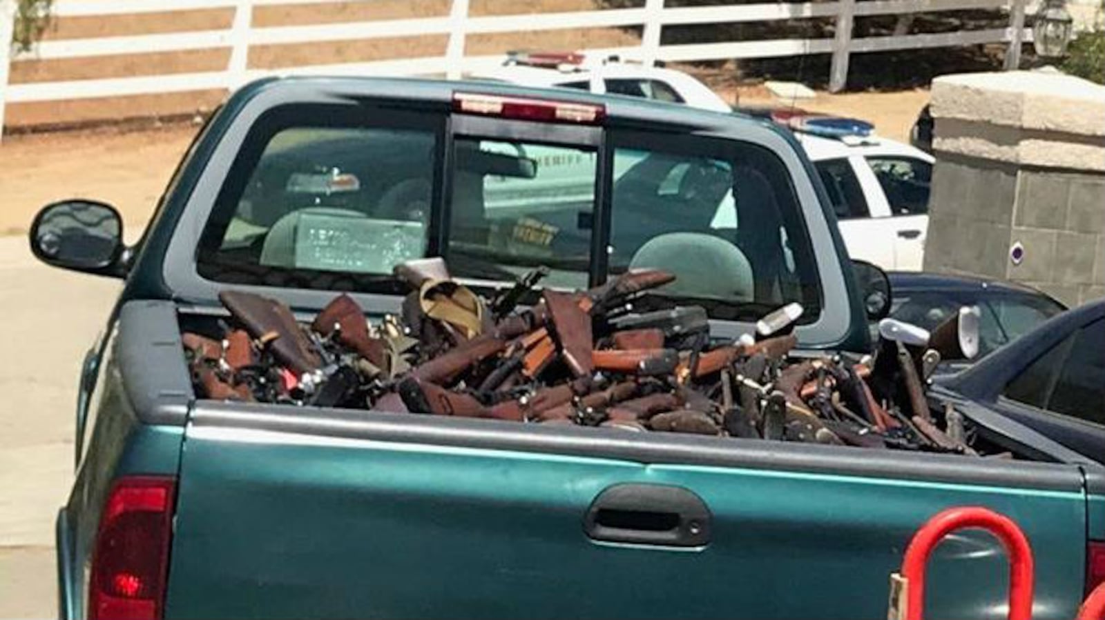 Pictured are some of the weapons seized after Los Angeles County Sheriff's Department officials received a tip about a convicted felon in possession of a large arsenal of weapons. Manuel Fernandez, 60, of Agua Dulce, was arrested on multiple weapons charges Thursday, June 14, 2018.