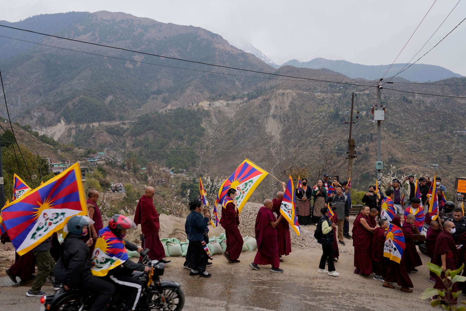 Exiled Tibetans mark the 66th anniversary of an uprising in Tibetan capital Lhasa, as they participate in a march in Dharamshala, India, Monday, March 10, 2025. (AP Photo/Ashwini Bhatia)