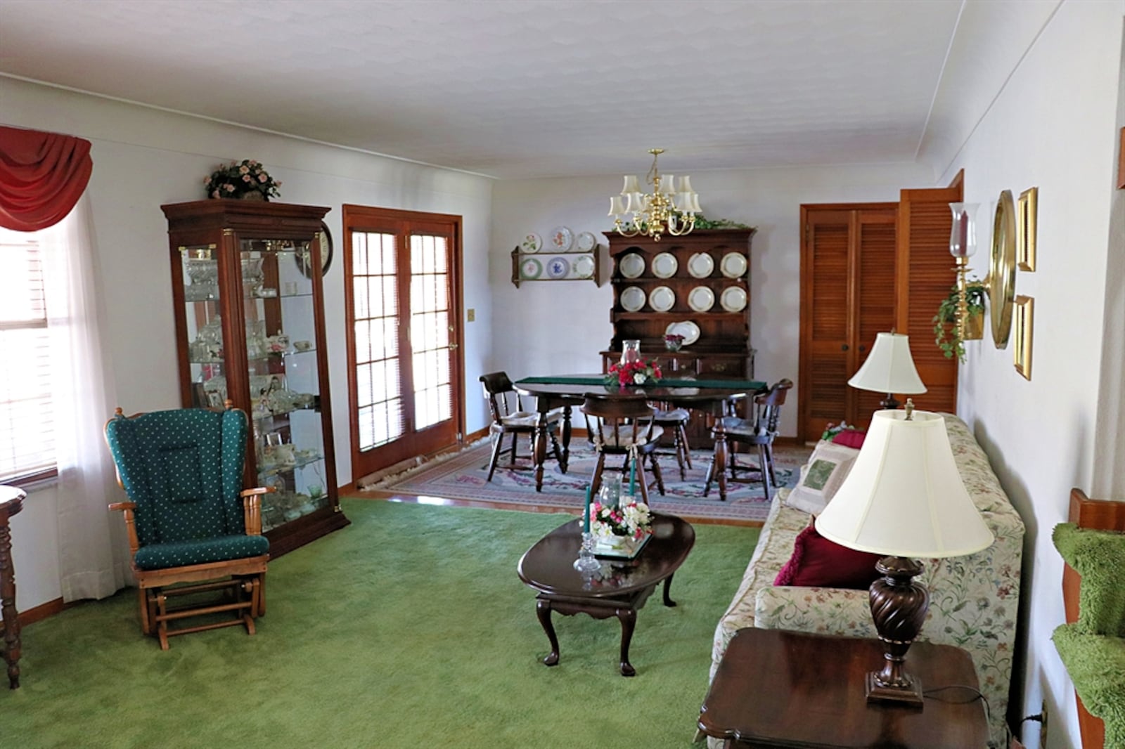 A picture window fills the living room with natural light. French doors open to the 30-by-12-foot covered backyard patio.