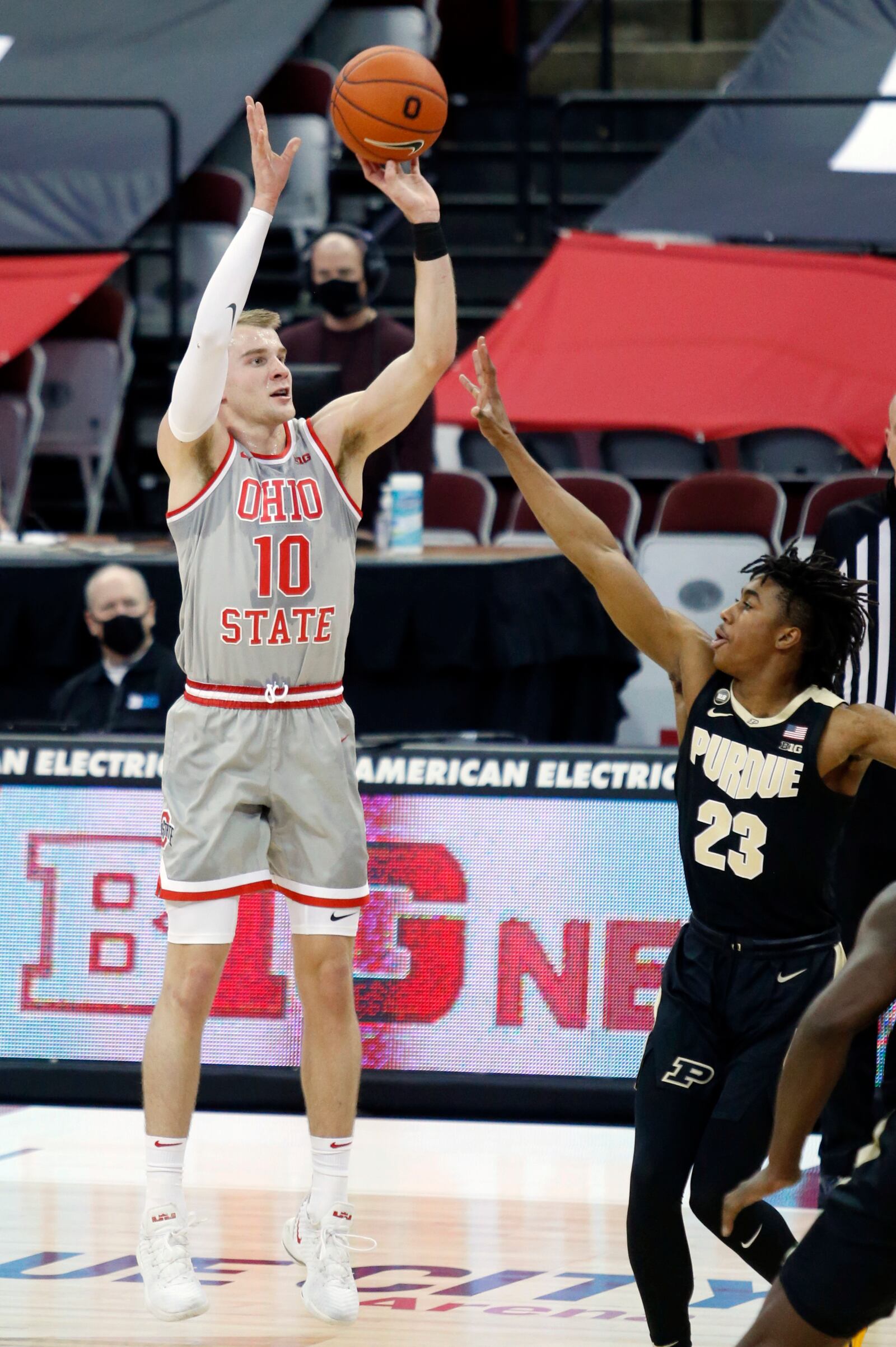 Ohio State forward Justin Ahrens, left, goes up for a shot against Purdue guard Jaden Ivey during the first half of an NCAA college basketball game in Columbus, Ohio, Tuesday, Jan. 19, 2021. (AP Photo/Paul Vernon)