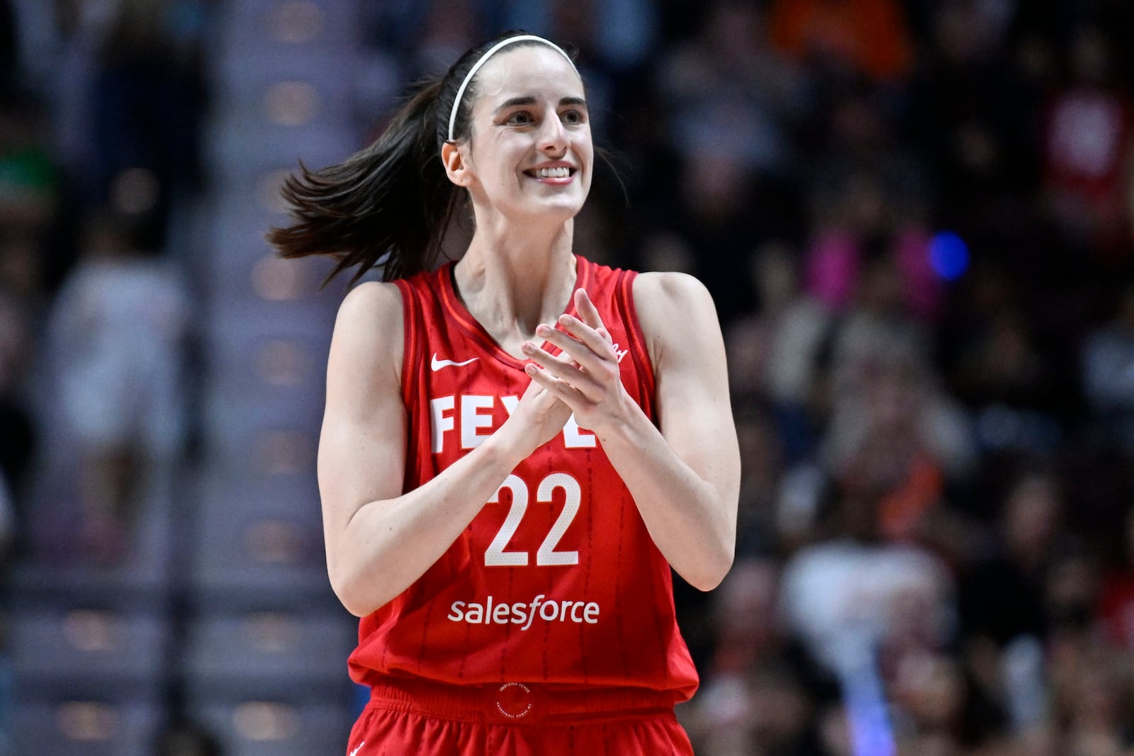 FILE - Indiana Fever guard Caitlin Clark (22) reacts during a first-round WNBA basketball playoff game against the Connecticut Sun, Wednesday, Sept. 25, 2024, in Uncasville, Conn. (AP Photo/Jessica Hill, File)