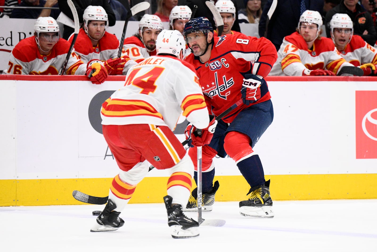 Washington Capitals left wing Alex Ovechkin skates with the puck during the first period of an NHL hockey game against Calgary Flames defenseman Joel Hanley, Tuesday, Feb. 25, 2025, in Washington. (AP Photo/Nick Wass)