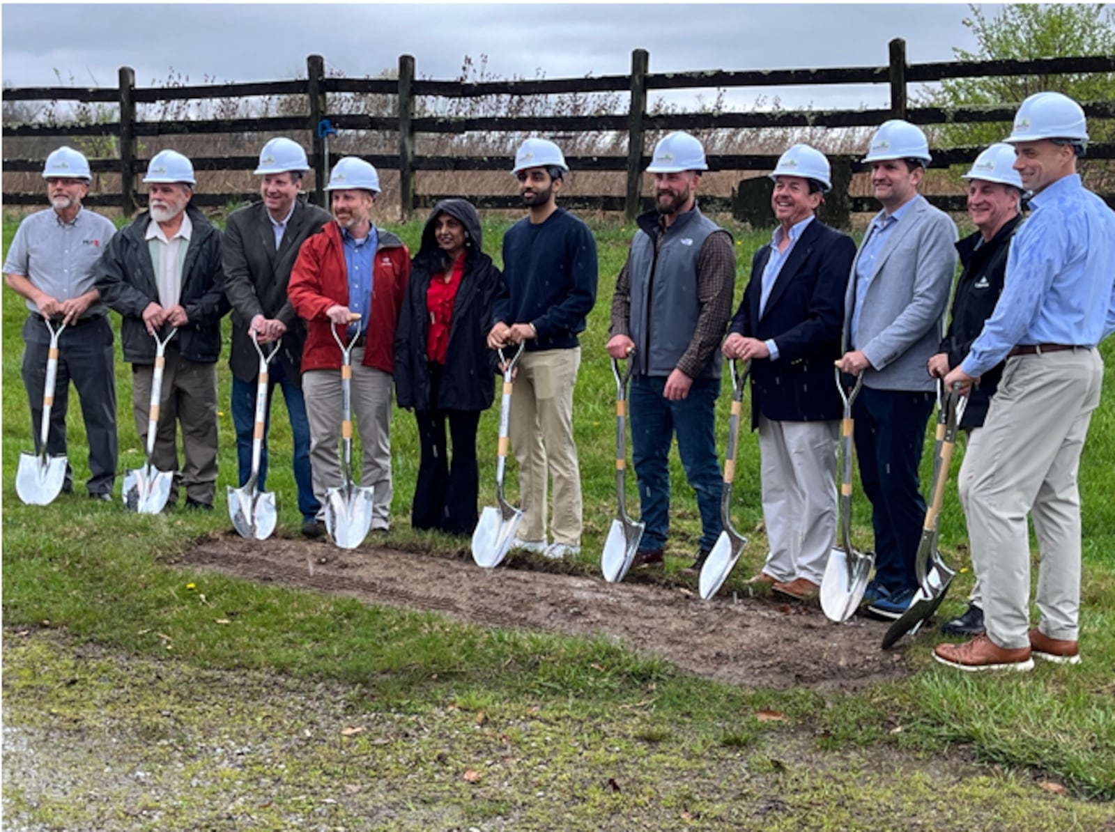 Representatives from the city of Lebanon and Doyle Hughes Development pose with  their shovels before breaking ground for the $450 million Parkside at Lebanon development on Ohio 63. The heavy rain on Tuesday, April 2, 2024 did not stop the ceremony.  ED RICHTER/STAFF