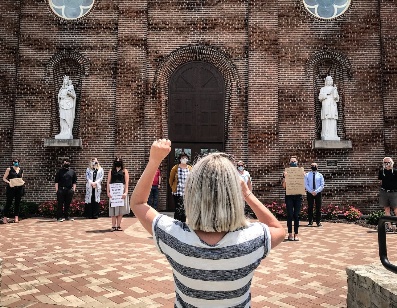 PHOTOS: Professors at the University of Dayton hold demonstration about school opening