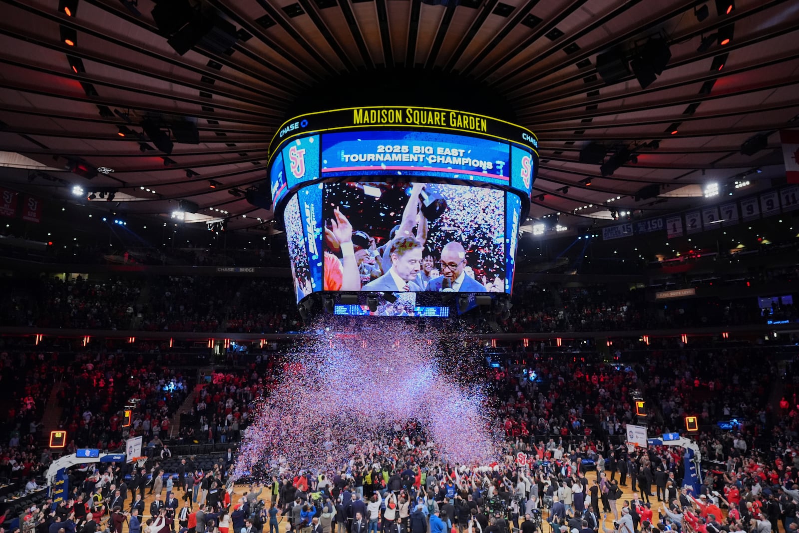 Fans watch as St. John's celebrates during the trophy ceremony after an NCAA college basketball game against Creighton in the championship of the Big East Conference tournament Saturday, March 15, 2025, in New York. (AP Photo/Frank Franklin II)