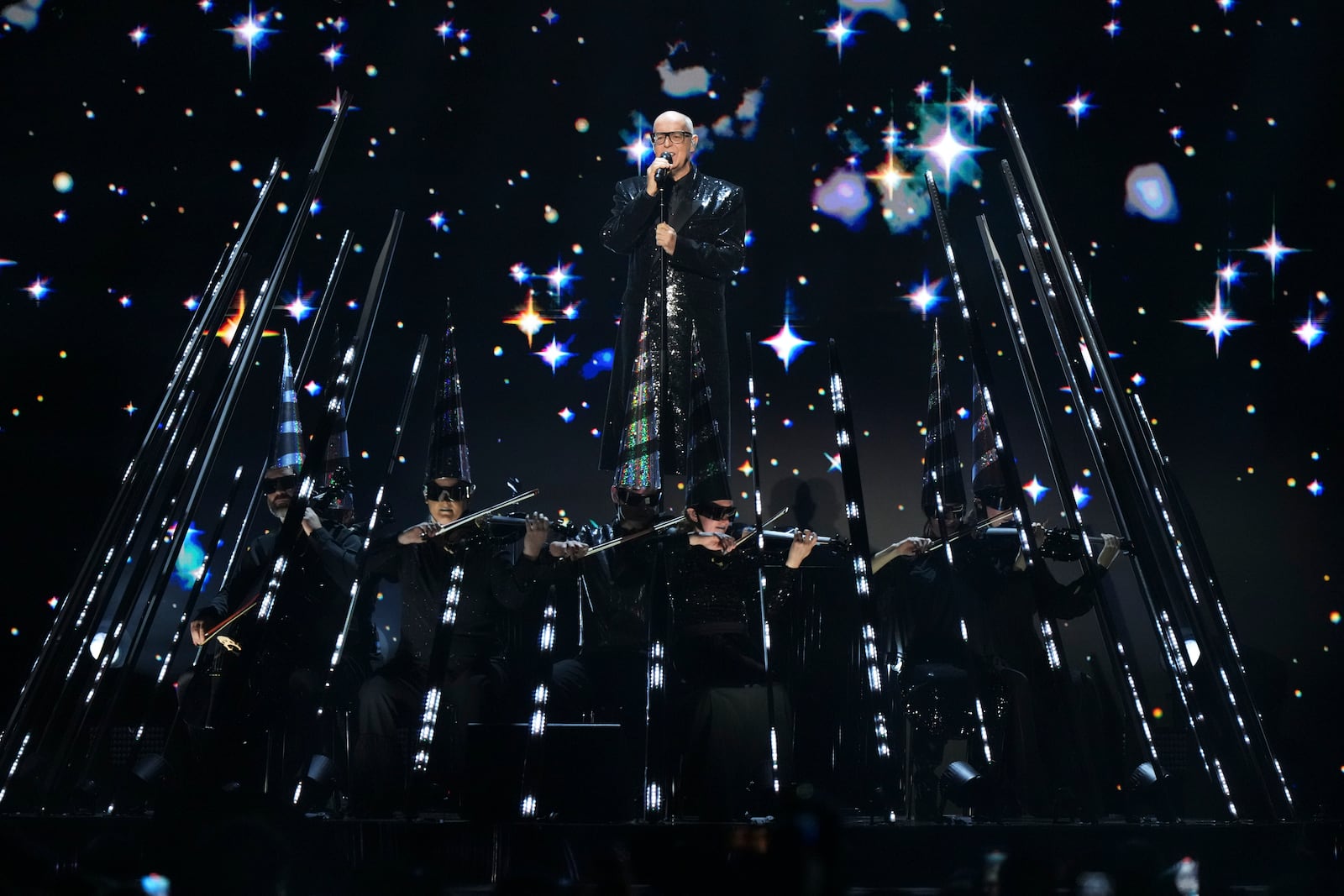 Neil Tennant from the 'Pet Shop Boys' performs alongside the Manchester Camerata during the MTV European Music Awards in Manchester, England, Sunday, Nov. 10, 2024. (Scott A Garfitt/Invision/AP)