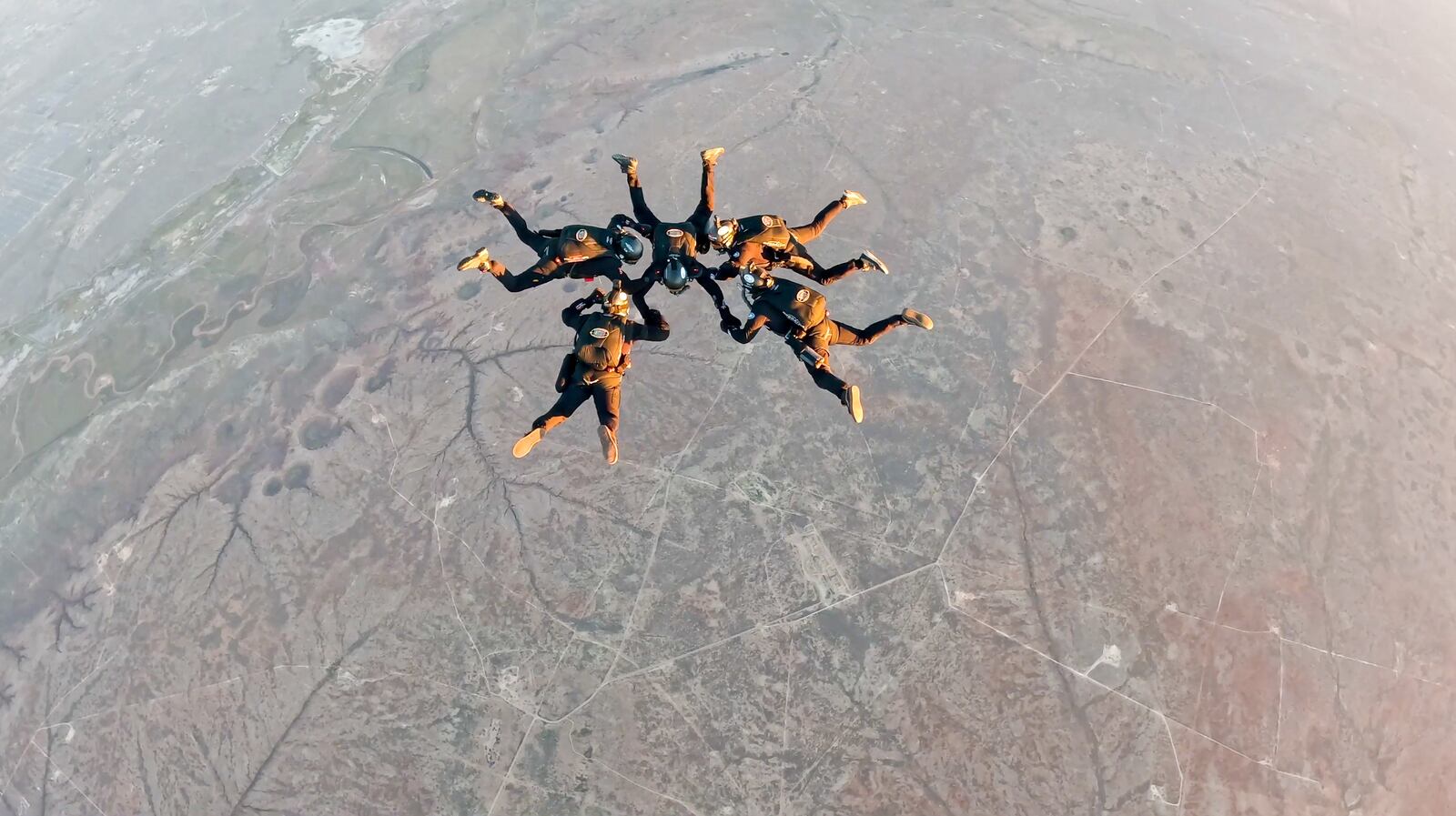 World record formation, from left: MSgt. (Ret) Jimmy Petrolia, CMSgt. Brandon Daugherty, Larry Connor  (middle), CMSgt. (Ret) Chris Lais, MSgt. Rob Dieguez. Chris Peterson/CONTRIBUTED