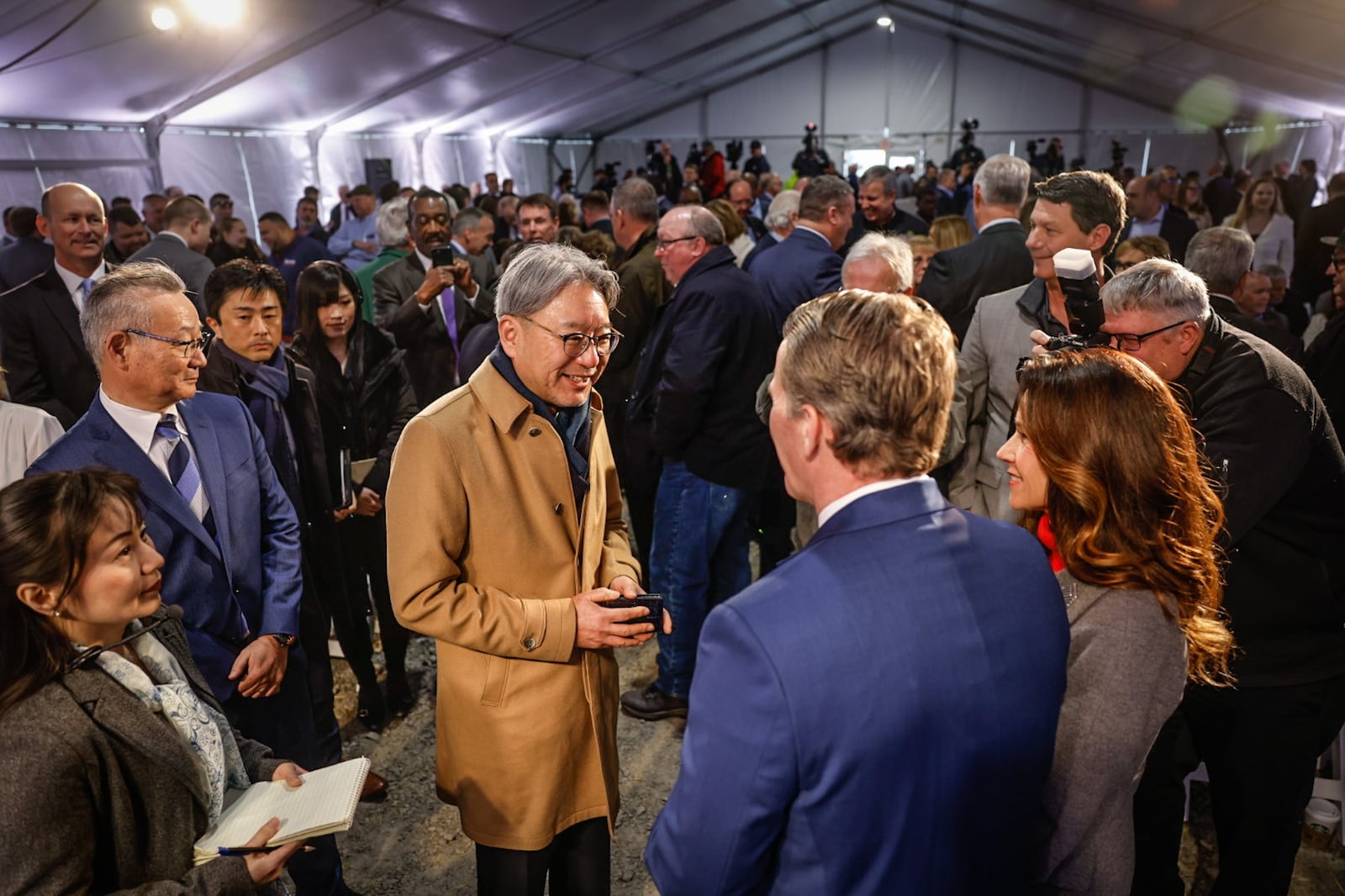 President and CEO of Honda Motor Company, Toshihiro Mibe, center left, talks with Ohio Lt. Gov. Joh Husted at the groundbreaking for the EV battery plant near Jeffersonville Tuesday February 28, 2023. JIM NOELKER/STAFF