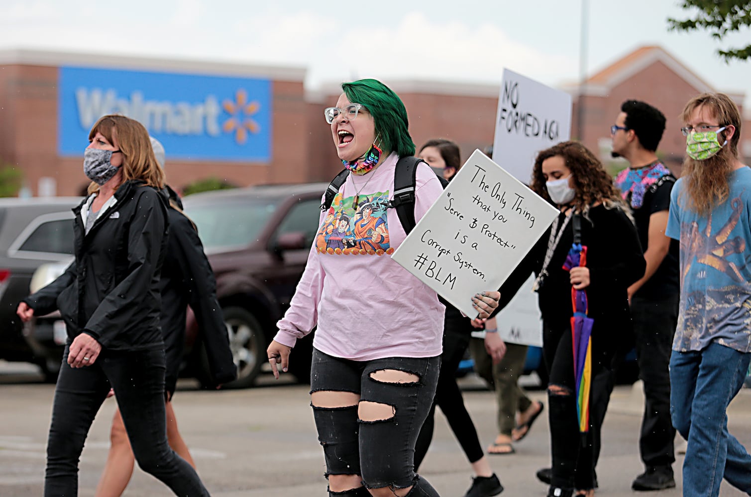 PHOTOS: Demonstrators rally for justice in Beavercreek