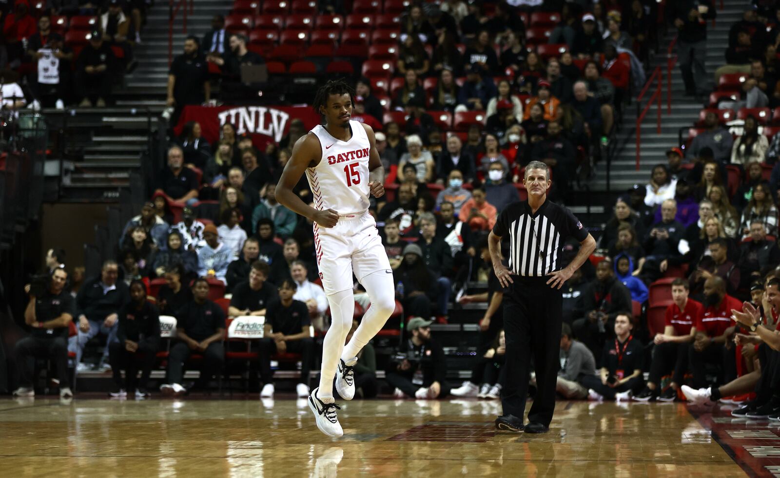 Dayton's DaRon Holmes II limps after hurting his ankle in the second half against UNLV on Tuesday, Nov. 15, 2022, at the Thomas & Mack Center in Las Vegas, Nev. David Jablonski/Staff