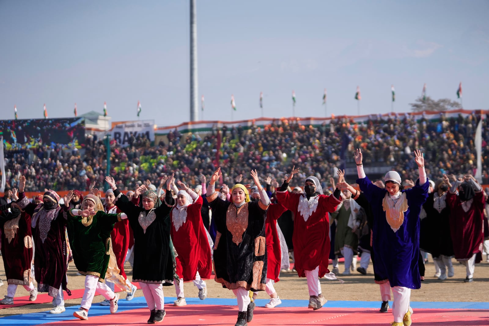 Kashmiri students perform during India's Republic Day parade in Srinagar, Indian controlled Kashmir, Sunday, Jan. 26, 2025. (AP Photo/Mukhtar Khan)