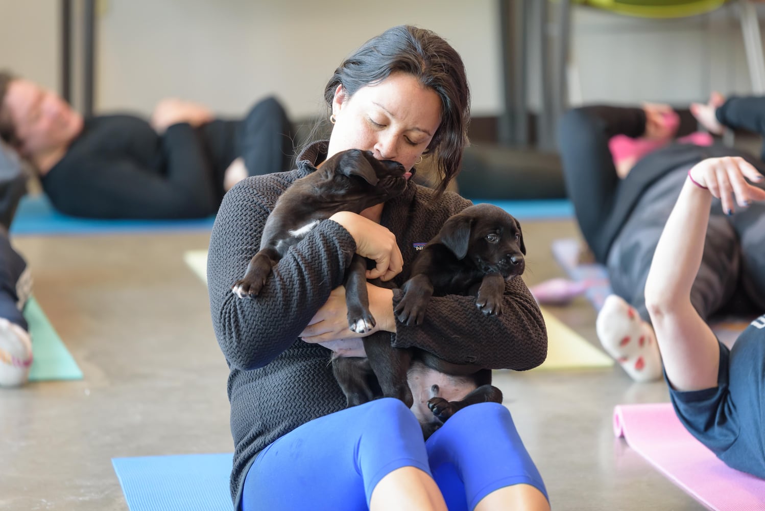 PHOTOS: Puppy Yoga at SICSA Pet Adoption and Wellness Center