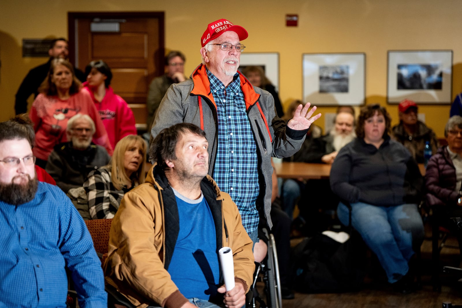 Cris Hopkin, a resident of Evanston, Wyo., asks a question about election integrity as Rep. Harriet Hageman, R-Wyo., holds a town hall meeting on Friday, March 14, 2025, in Evanston, Wyo. (AP Photo/Spenser Heaps)