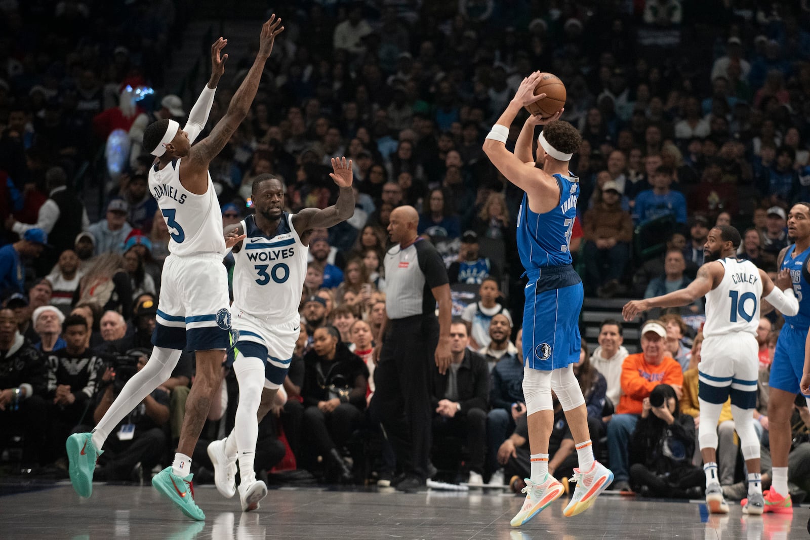 Dallas Mavericks guard Klay Thompson (31) attempts a three-pointer in the first half of an NBA basketball game on Wednesday, Dec. 25, 2024, in Dallas. (AP Photo/Emil T. Lippe)