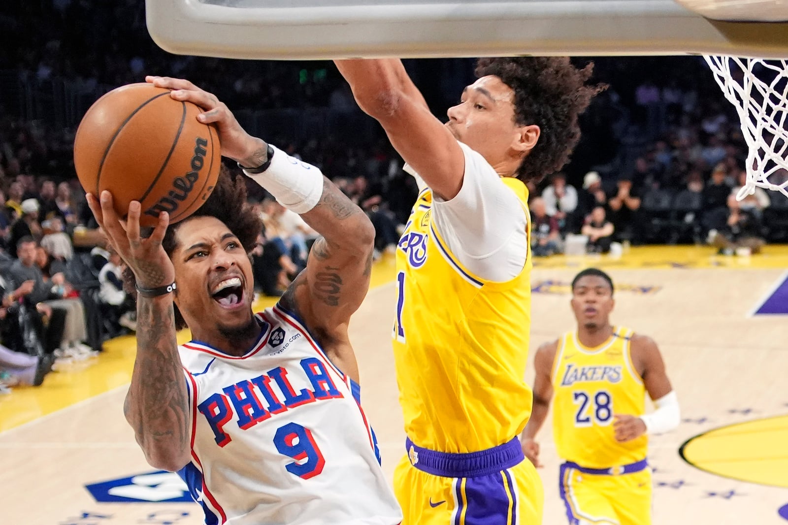 Philadelphia 76ers guard Kelly Oubre Jr., left, shoots as Los Angeles Lakers center Jaxson Hayes defends during the first half of an NBA basketball game, Friday, Nov. 8, 2024, in Los Angeles. (AP Photo/Mark J. Terrill)