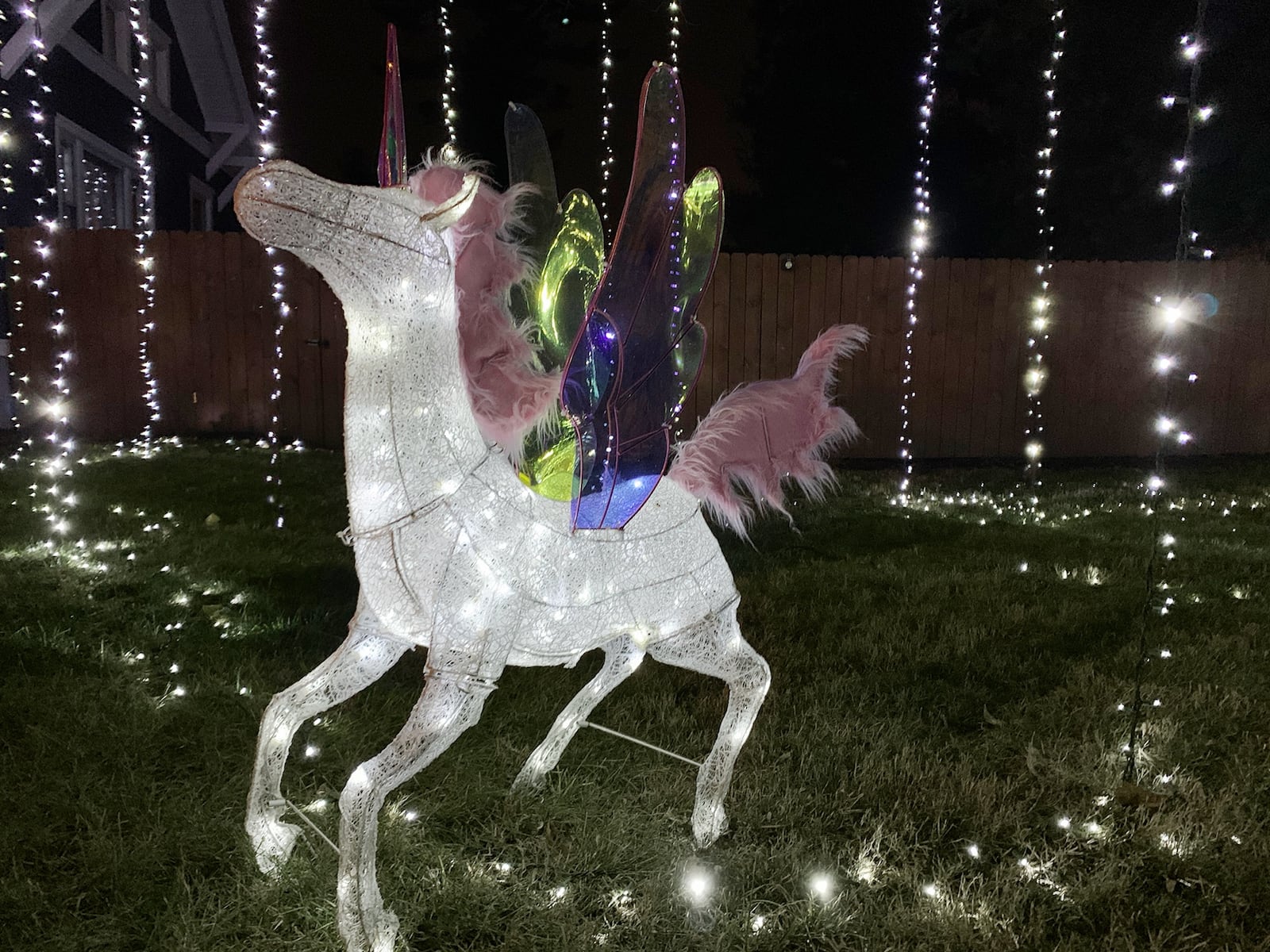 The Crofts’ holiday light display features 5 unicorns and around 4,000 lights hanging from the trees and covering the ground. CONTRIBUTED