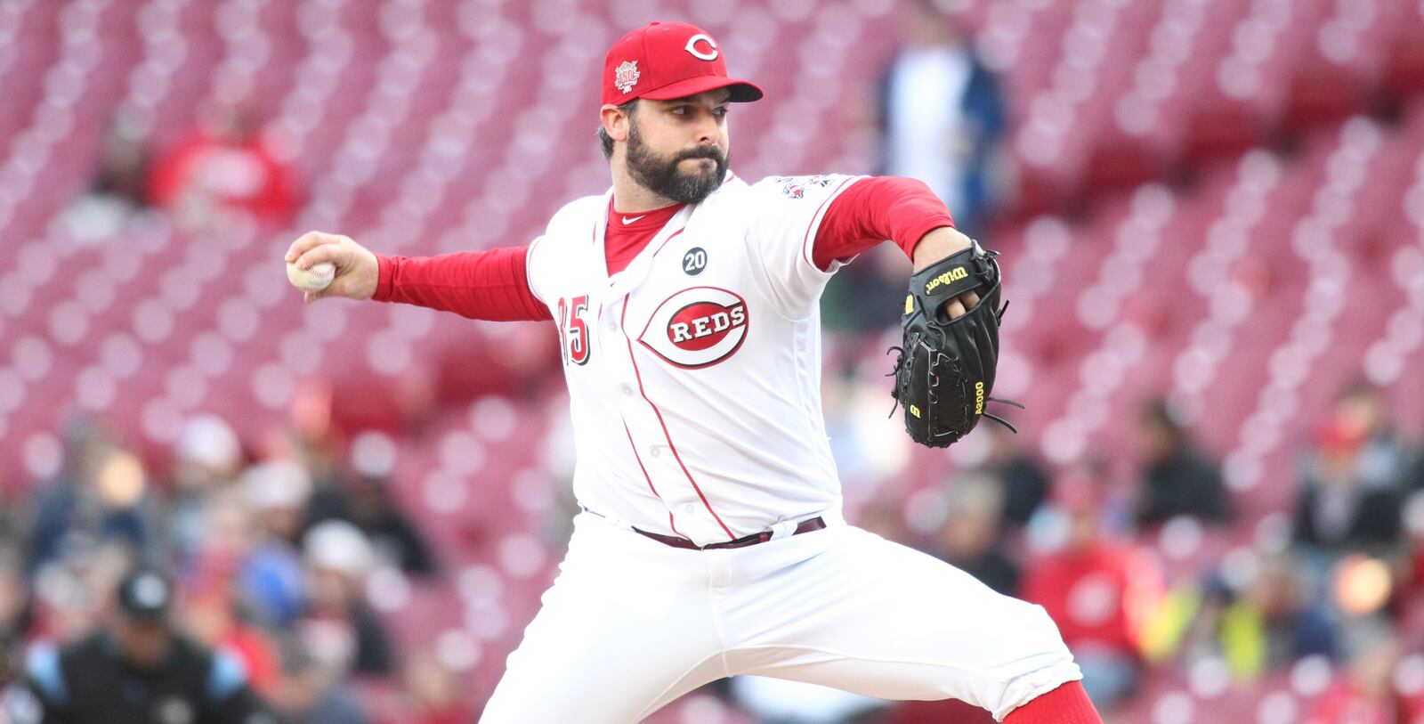 Reds starter Tanner Roark pitches against the Brewers on Monday, April 1, 2019, at Great American Ball Park in Cincinnati.