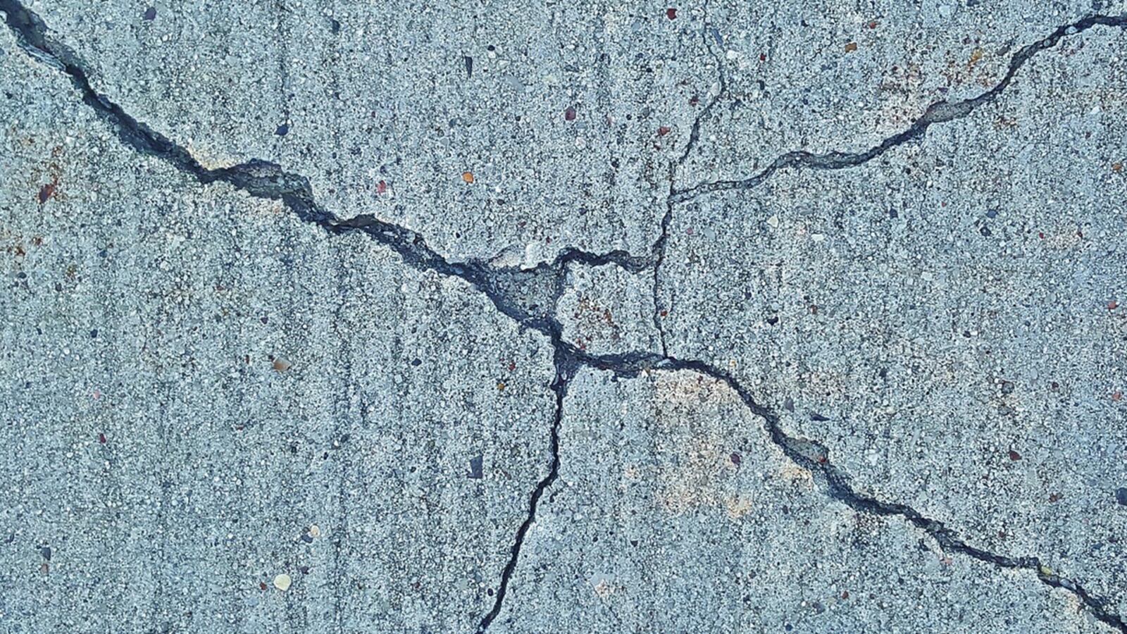 A crack  in cement from an earthquake.