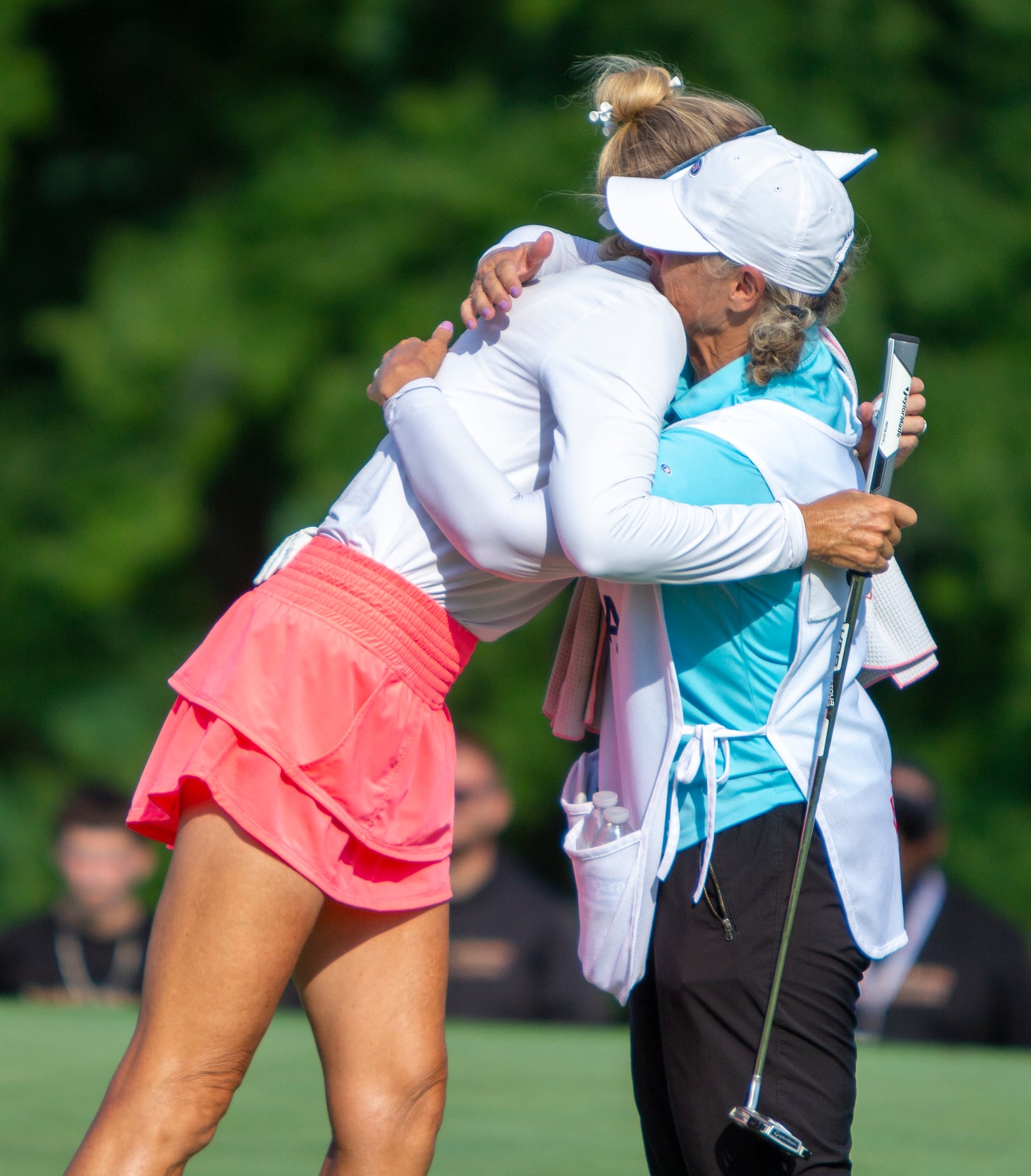 Jill McGill's hugs her sister and caddie, Shelley O'Keefe, on the 18th green Sunday after winning the U.S. Senior Women's Open at NCR Country Club. CONTRIBUTED/Jeff Gilbert