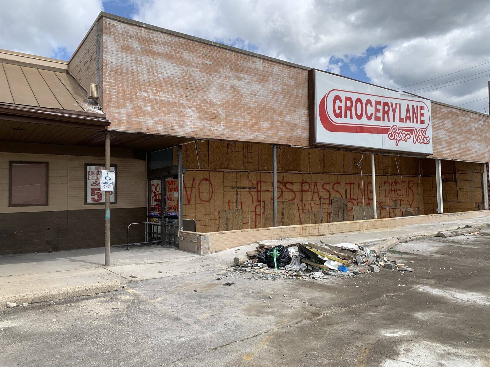 Deep Patel, owner of the Grocery Lane, said he initially intended to rebuild and reopen the grocery store. But because he doesn t own the building, he wasn t eligible for Small Business Administration assistance and the store continues to suffer repeated damage from people breaking in and stealing copper wires and the small bit to remaining inventory. The store is rebuilt but we re just not reopening because of the theft issue, he said. They do it every day. I fix it, they break it.