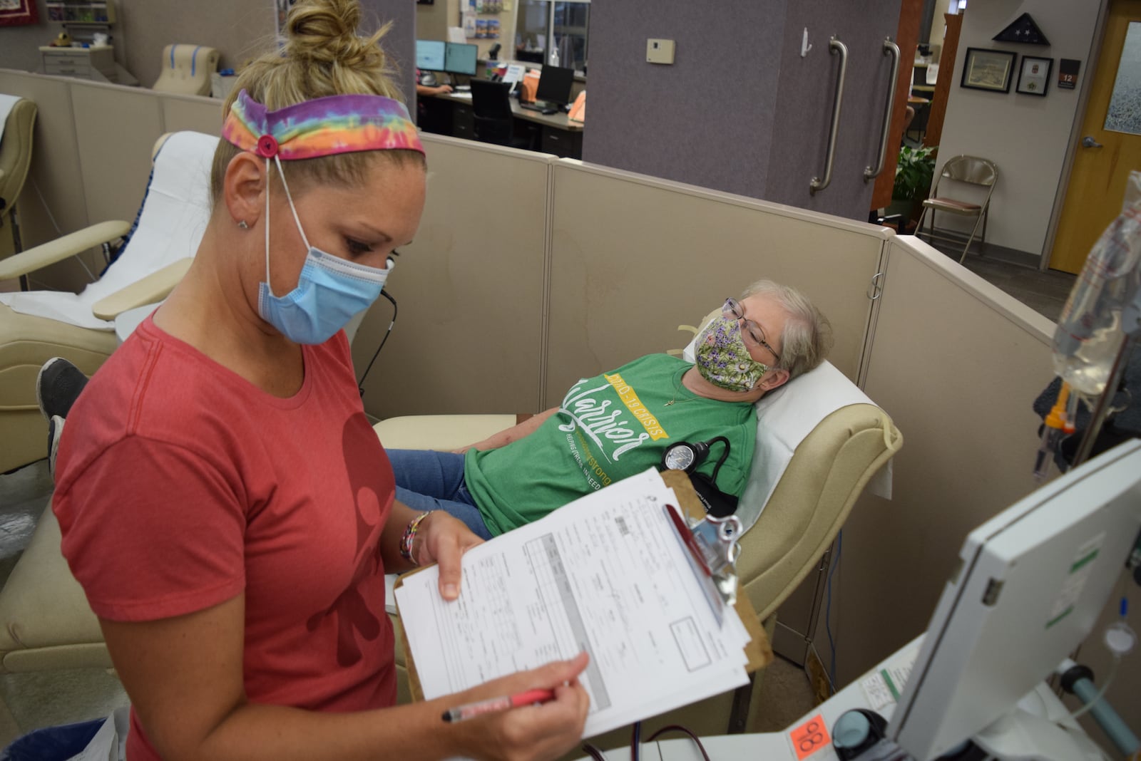 Elizabeth Isenberger with phlebotomist is Jennifer Anderson donating convalescent plasma.