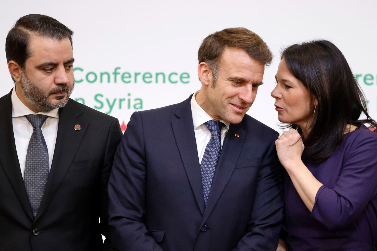 France's President Emmanuel Macron, center, Syria's Interim Foreign Minister Asaad Al-Shibani, left, and German Foreign Minister Annalena Baerbock pose for a photo during the International Conference on Syria at the Ministerial Conference Center, in Paris, France, Thursday, Feb. 13, 2025. (Ludovic Marin, Pool Photo via AP)