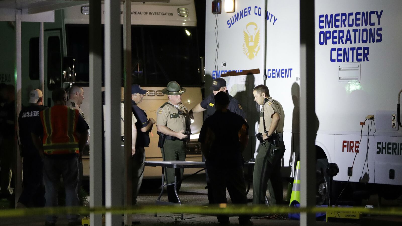 Law enforcement officials work at a command center set up at North Sumner Elementary School Saturday, April 27, 2019, in Bethpage, Tenn., as they search for homicide suspect Michael Lee Cummins. Cummins, 25, is suspected of killing six people found beaten to death in their Westmoreland home Saturday, including his parents, uncle and a 12-year-old girl. A seventh victim was found dead in her home about a mile away. A surviving victim, identified by family members as Cummins’ grandmother, was left in critical condition.