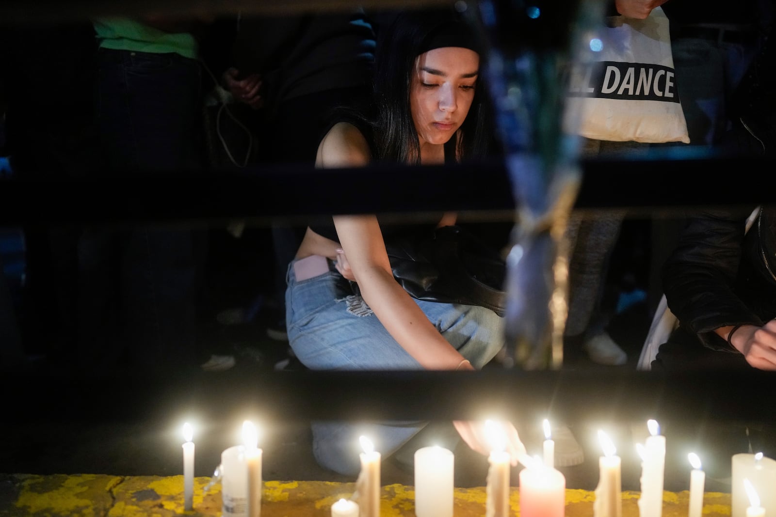 Fans light candles outside the hotel where former One Direction singer Liam Payne was found dead after he fell from a balcony in Buenos Aires, Argentina, Wednesday, Oct. 16, 2024. (AP Photo/Natacha Pisarenko)