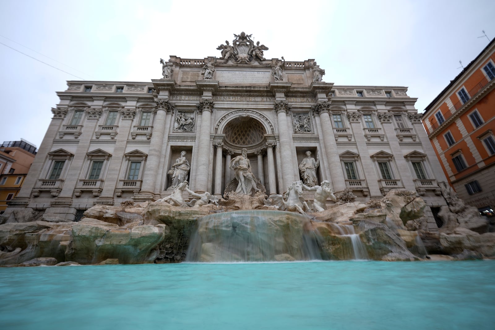 A view of the 18th century Trevi Fountain, one of Rome's most iconic landmarks, as it reopens to the public after undergoing maintenance, just on time for the start of the Jubilee Year, an event expected to draw millions of visitors to the Eternal City, in Rome, Sunday, Dec. 22, 2024. (AP Photo/Andrew Medichini)