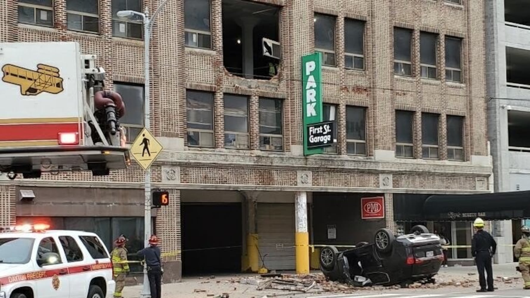 Car falls from parking garage