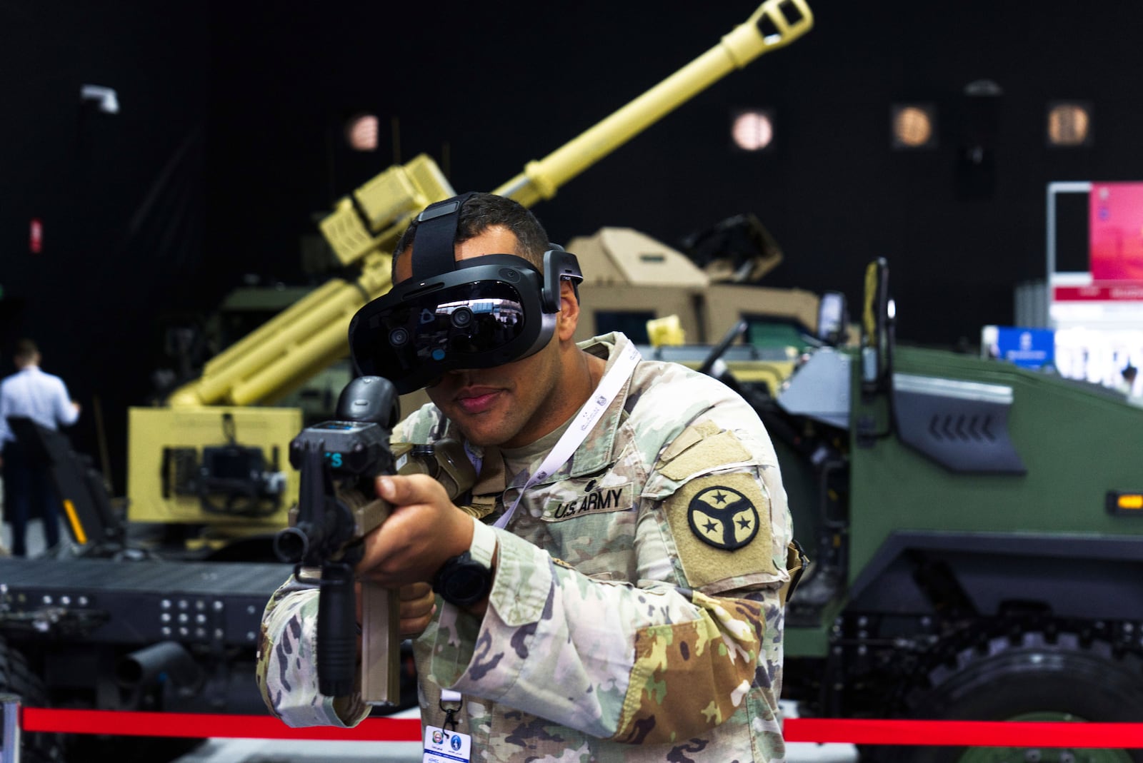 U.S. Army Sgt. Tony Hall of the 278th Armored Cavalry Regiment of Tennessee performs an electronic weapons training at the biennial International Defense Exhibition and Conference arms show in Abu Dhabi, United Arab Emirates, Monday, Feb. 17, 2025. (AP Photo/Jon Gambrell)