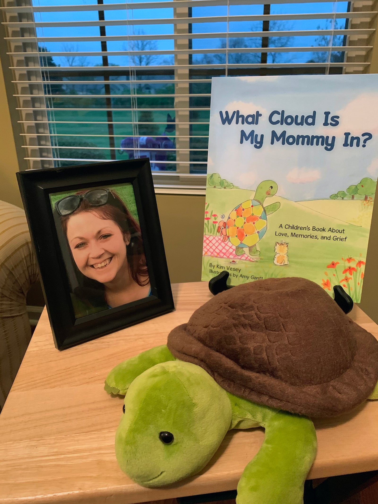 Vesey's books use turtles as the main character. She has comfort items, including this stuffed turtle, for sale on her website. Pictured is Sarah Vesey, Vesey's daughter.