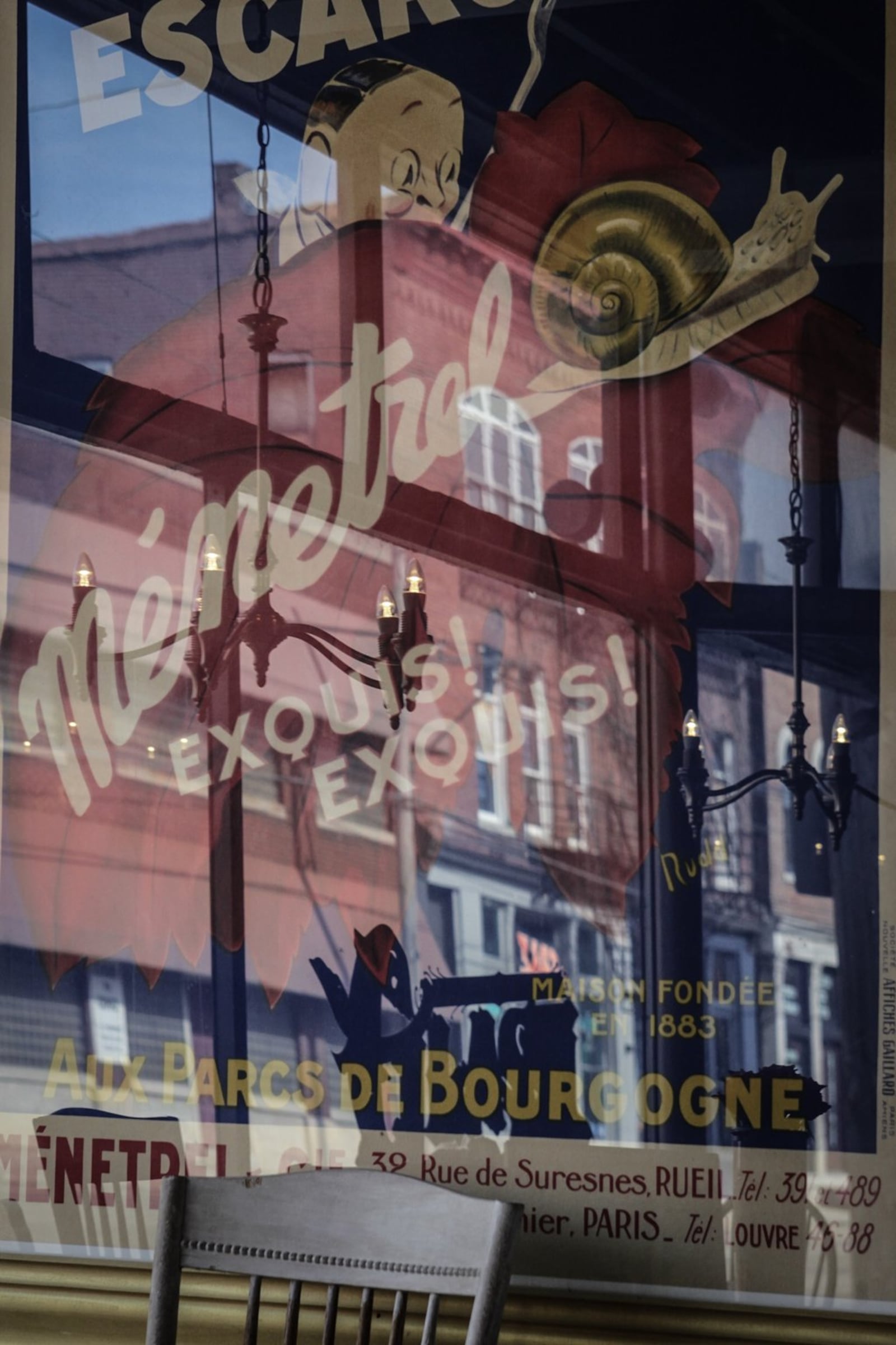 A poster hanging on the wall of Glasz Bleu Oven on Wayne Ave., reflects other buildings on Wayne that are being sold and turned into businesses. JIM NOELKER/STAFF