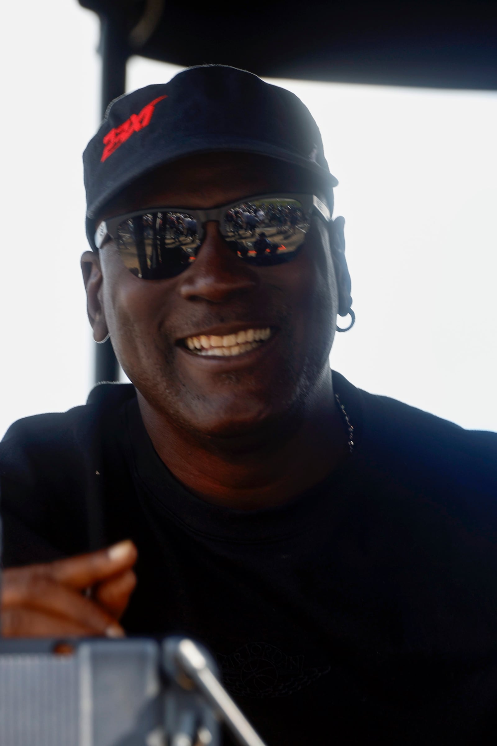 Co-Owner Michael Jordan of 23XII Racing sits in his pit box during a NASCAR Cup Series auto race at Talladega Superspeedway, Sunday, Oct. 6, 2024, in Talladega, Ala. (AP Photo/ Butch Dill)