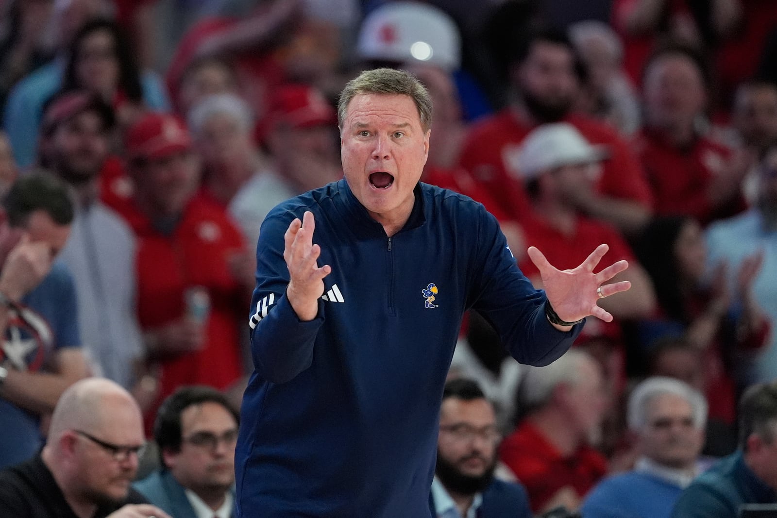 Kansas head coach Bill Self yells to his players during the second half of an NCAA college basketball game against Houston Monday, March 3, 2025, in Houston. (AP Photo/David J. Phillip)