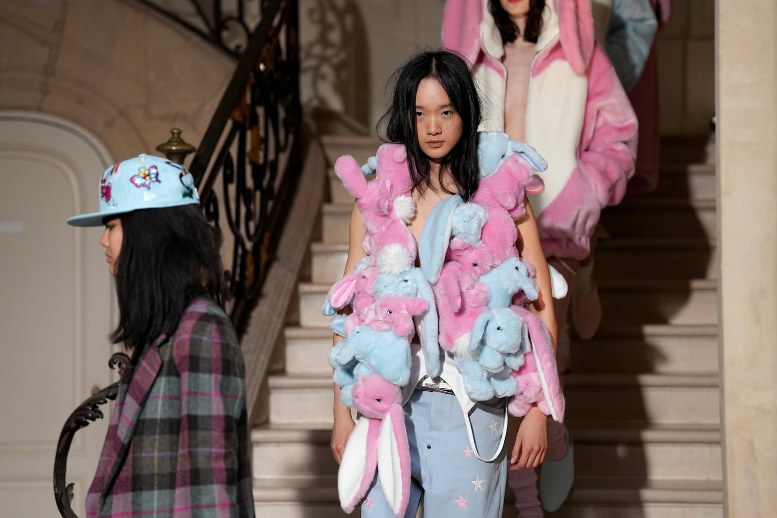 Models wear creations as part of the Kenzo Fall/Winter 2025-2026 Womenswear collection presented in Paris, Friday, March 7, 2025. (Photo by Scott A Garfitt/Invision/AP)