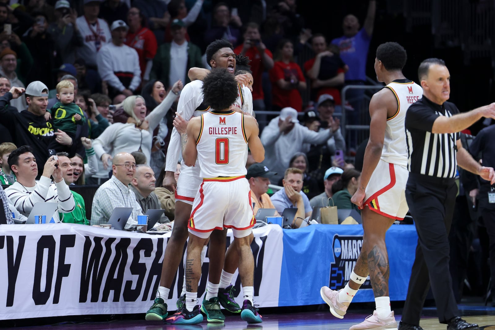 Maryland center Derik Queen, center, reacts with guard Ja'Kobi Gillespie after making the game-winning shot against Colorado State during the second half in the second round of the NCAA college basketball tournament, Sunday, March 23, 2025, in Seattle. (AP Photo/Ryan Sun)