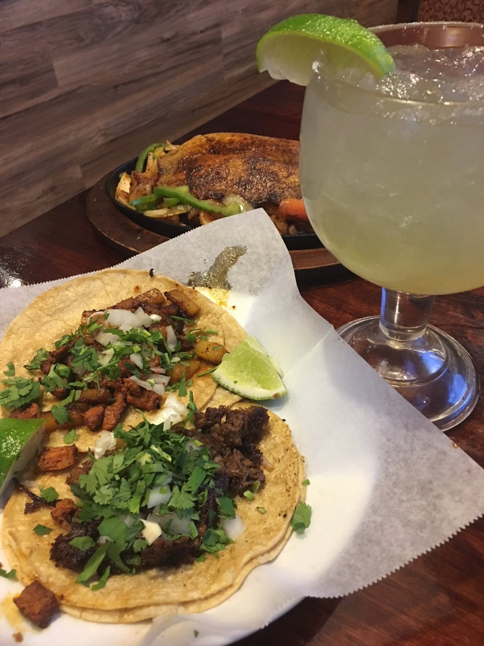 A pork and tongue taco (foreground), fajita de seafood and a margarita served up at Chiapas Mexican Grill in Centerville. Contributed photo by Alexis Larsen