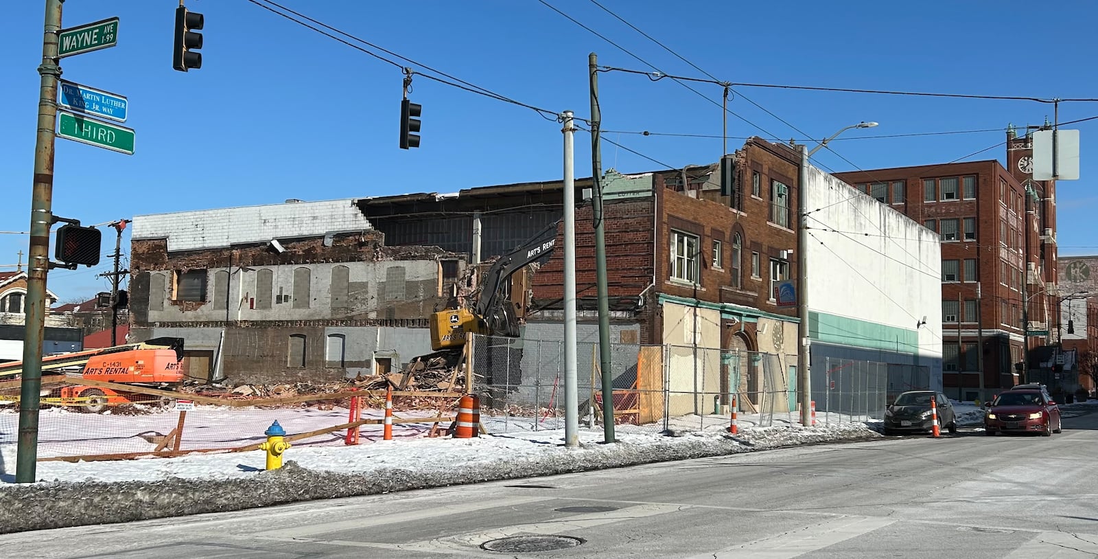 The last of the former KK Motorcycle Supply building is demolished on East Third Street across from Wayne Avenue in downtown Dayton on Jan. 15, 2025. JEREMY P. KELLEY / STAFF