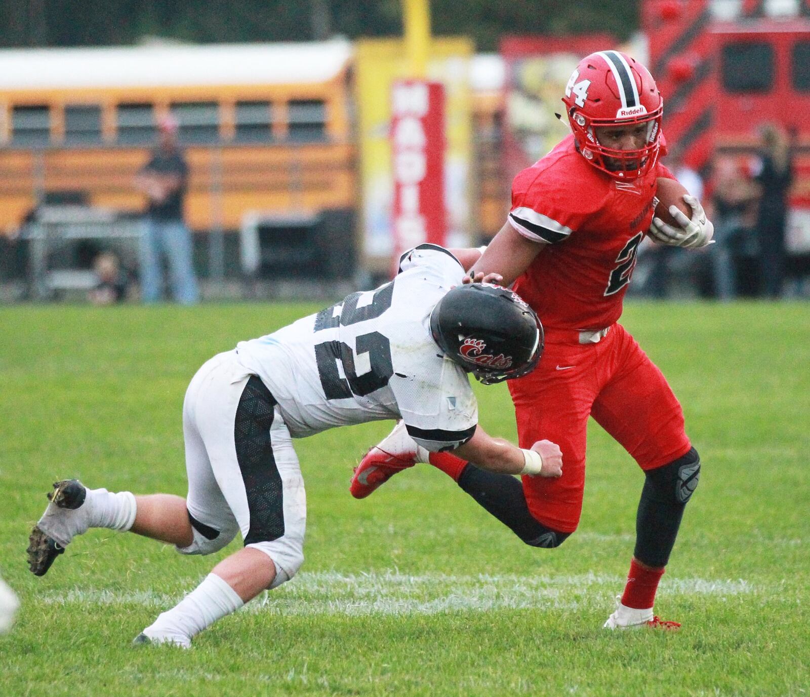 Madison QB Quincy Brown (with ball) eludes Charlie Webber of Franklin. Franklin defeated host Madison 42-6 in a Week 1 high school football opener on Friday, Aug. 30, 2019. MARC PENDLETON / STAFF