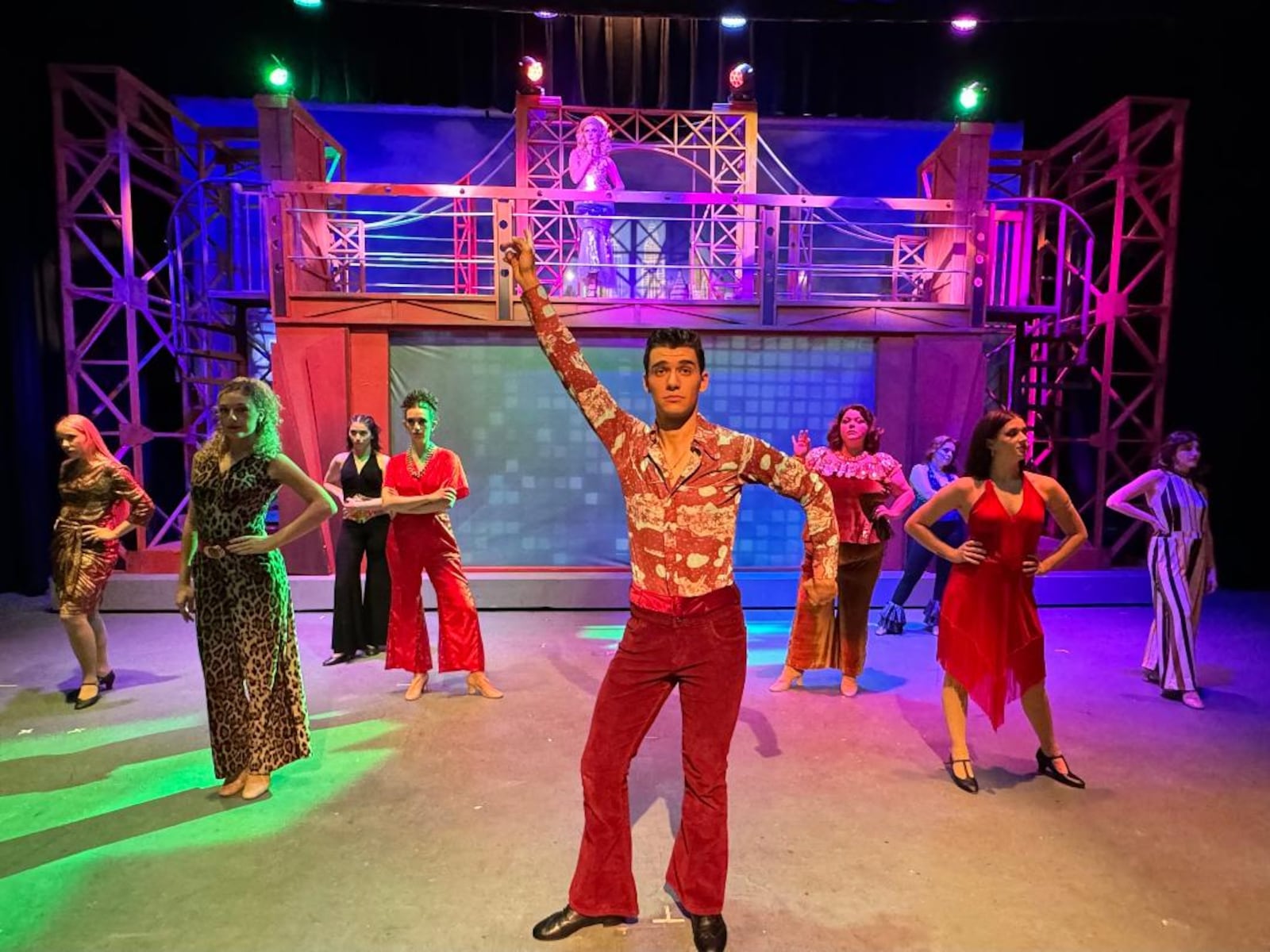 Nick Valle (Tony Manero) and the cast of La Comedia Dinner Theatre's production of "Saturday Night Fever." PHOTO BY JUSTIN WALTON