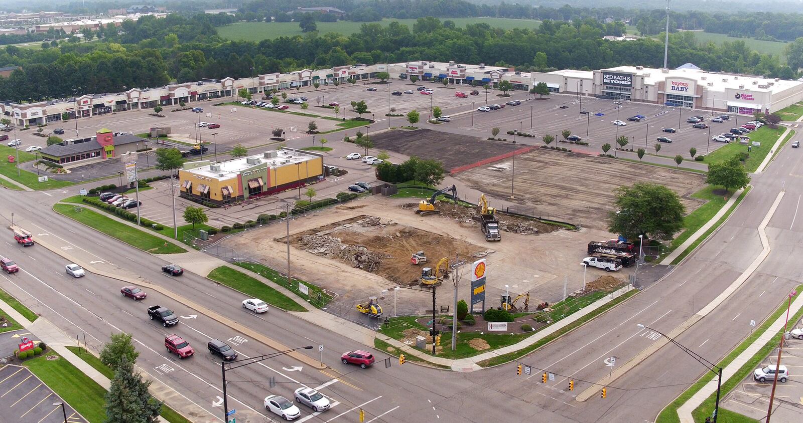 The former Shell station and Wilmington and Clyo has been demolished to make way for a new UDF and is one of many new construction projects underway along the Wilmington Pike corridor.   TY GREENLEES / STAFF