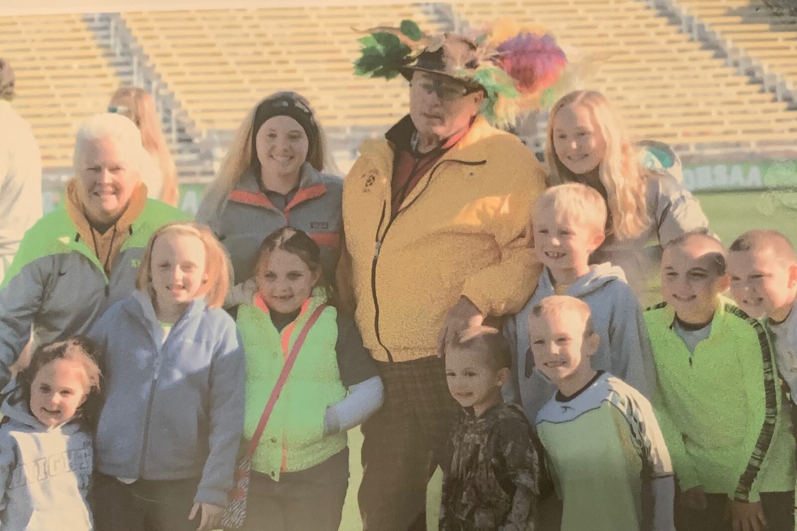 Alter's Bob Ellis celebrates the team's 1996 state title with his family.