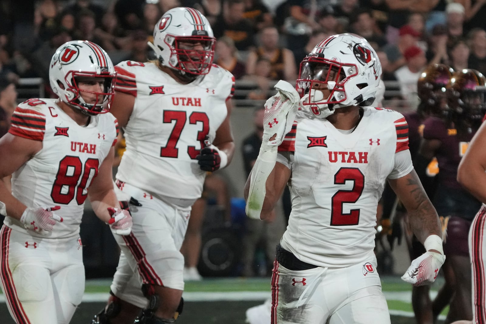 Utah running back Micah Bernard (2) reacts after scoring a touch down against Arizona State in the second half during an NCAA college football game, Friday, Oct. 11, 2024, in Tempe, Ariz. (AP Photo/Rick Scuteri)