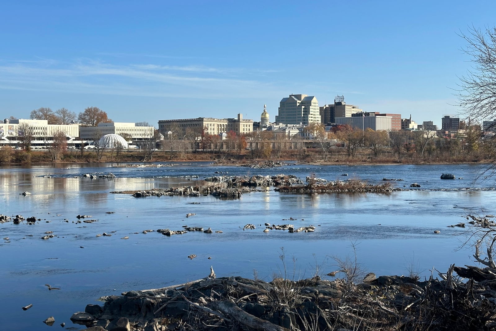 The Delaware River overlooking Trenton, N.J. flows downstream as seen from from Morrisville, Pa., on Monday, Nov. 25, 2024. (AP Photo/Mike Catalini)