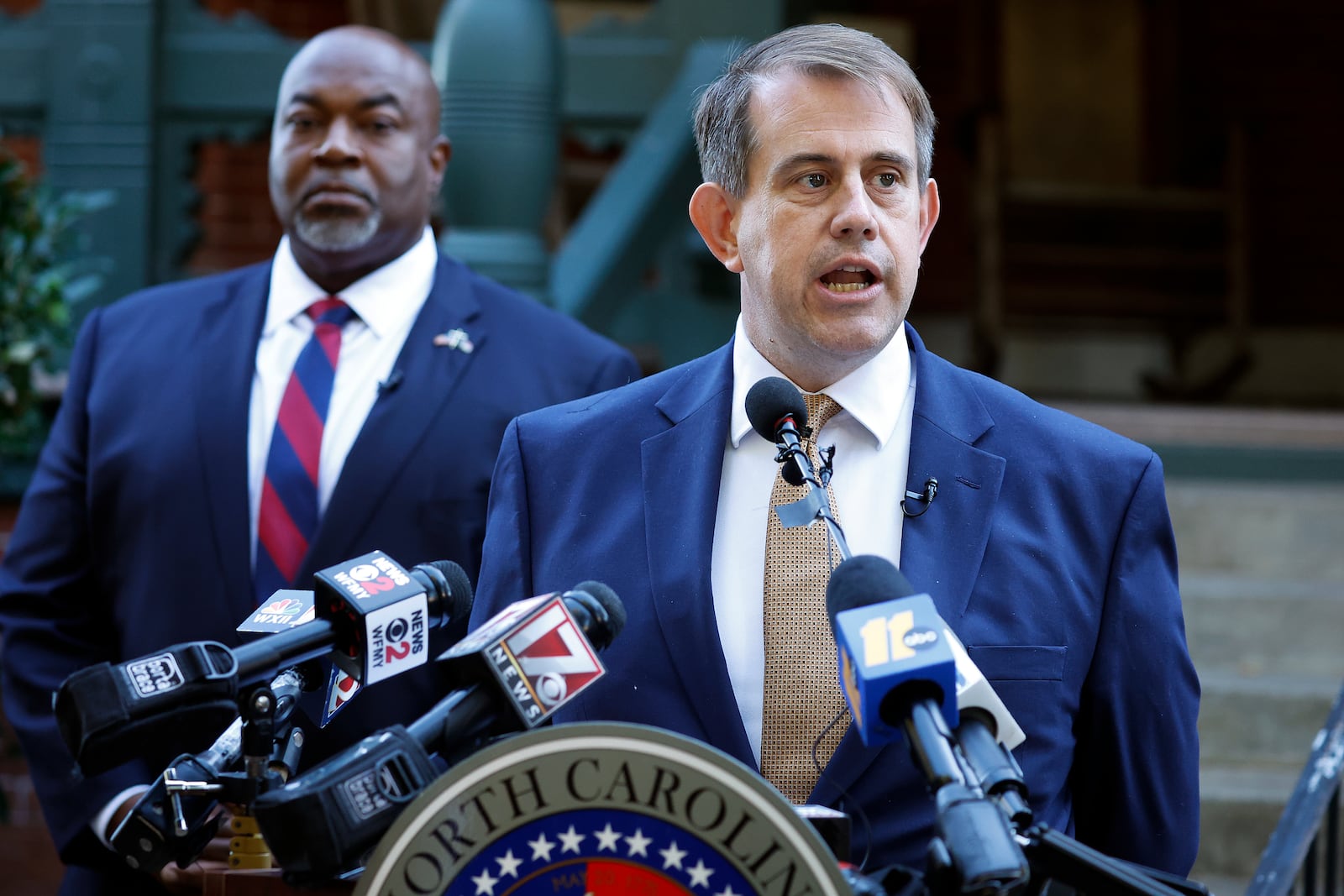 Attorney Jesse Binnall, right, speaks at a news conference, with his client North Carolina Lt. Gov. Mark Robinson, left, in Raleigh, N.C., Tuesday, Oct. 15, 2024. (AP Photo/Karl B DeBlaker)