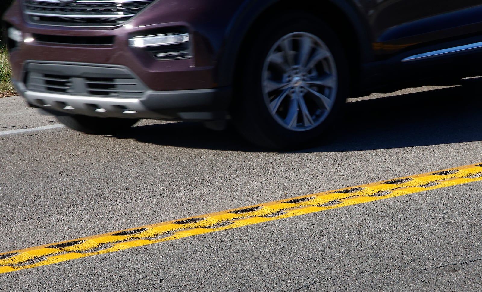 Rumble strips have been added to the center of Ohio Route 41 near where a fatal bus crash occurred earlier this year. BILL LACKEY/STAFF