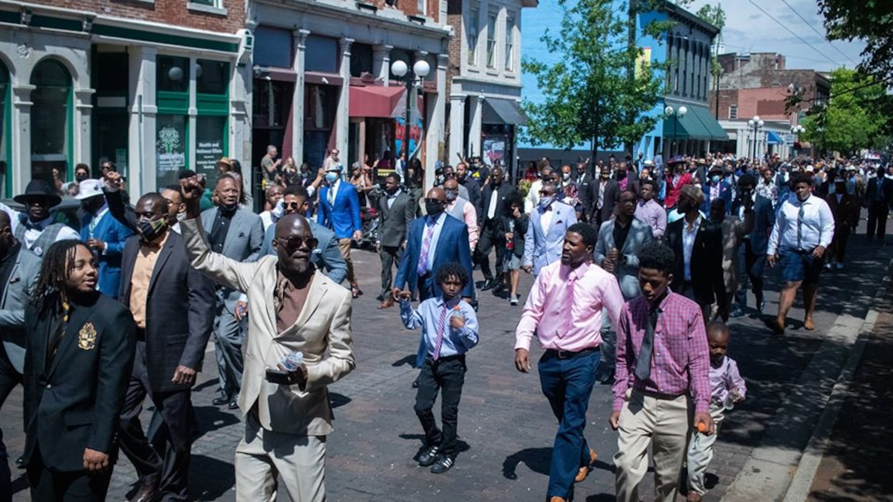 Photos: 300 men in suits march in Dayton