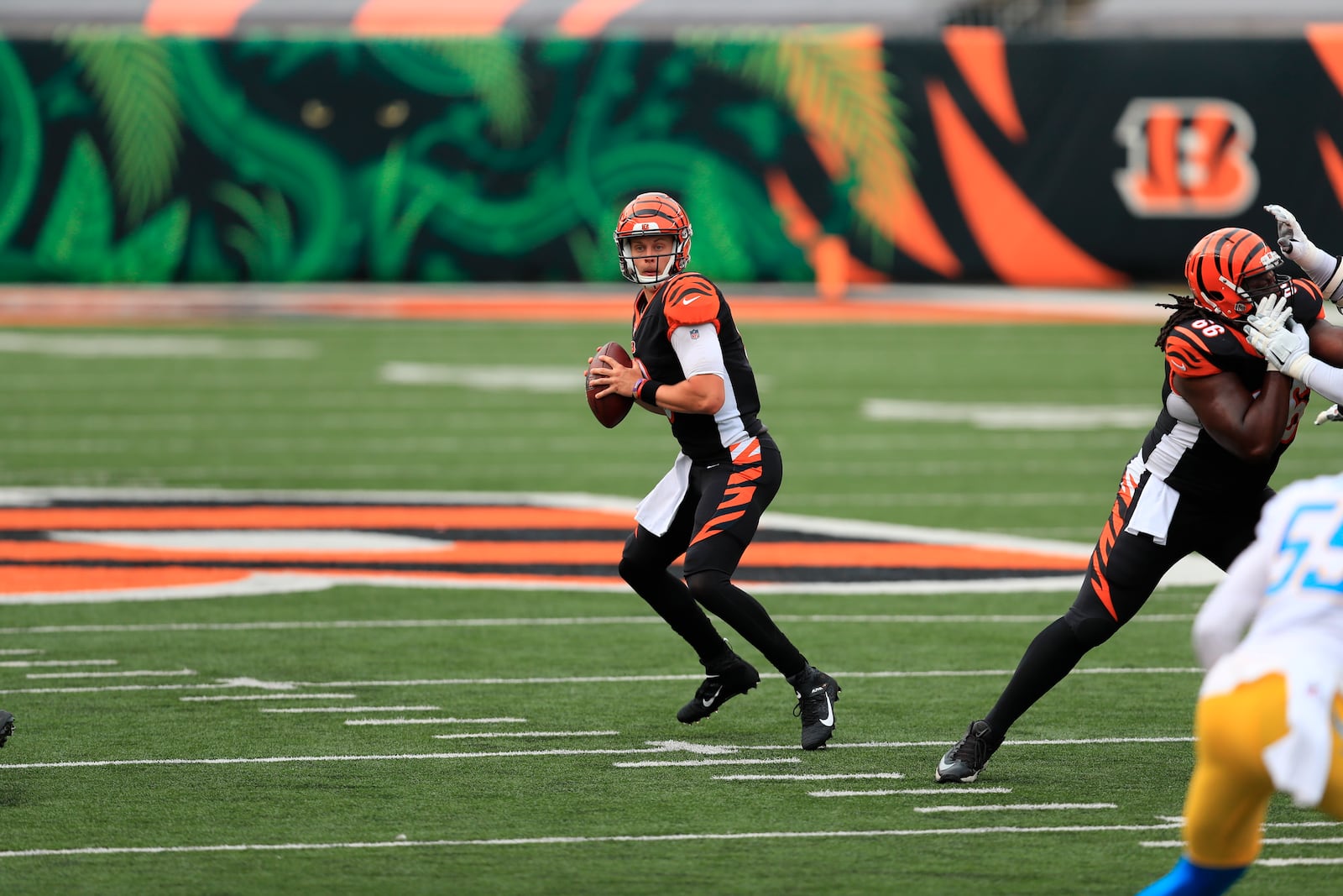 Cincinnati Bengals quarterback Joe Burrow (9) looks to throw during the first half of an NFL football game against the Los Angeles Chargers, Sunday, Sept. 13, 2020, in Cincinnati. (AP Photo/Aaron Doster)