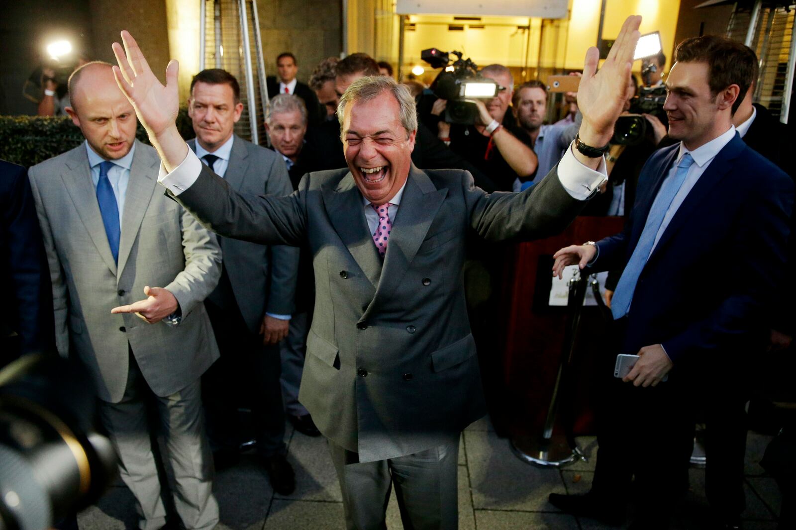 FILE - In this Friday, June 24, 2016 file photo Nigel Farage, the leader of the UK Independence Party, celebrates and poses for photographers as he leaves a "Leave.EU" organisation party for the British European Union membership referendum in London. (AP Photo/Matt Dunham, File)